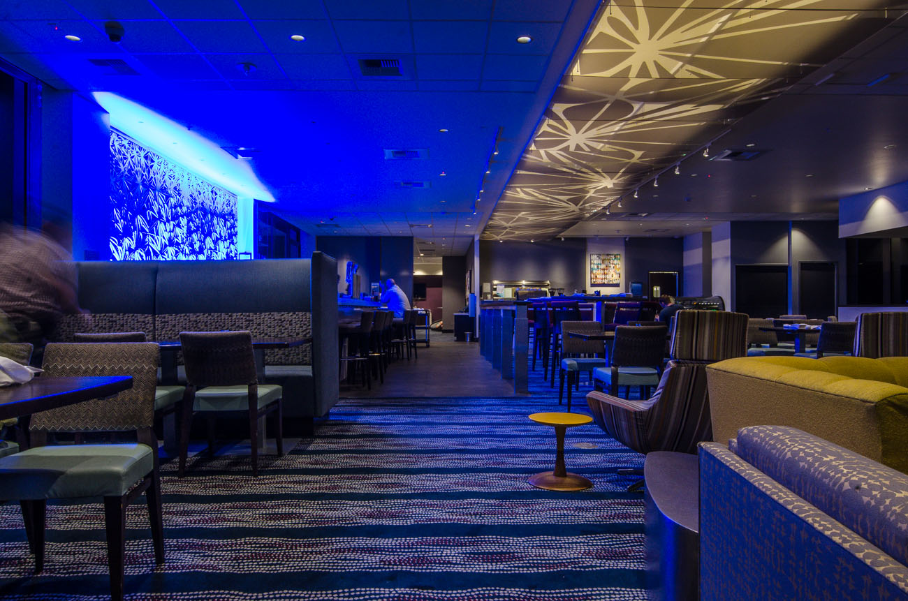 Sultry blue lighting surrounds the 24 foot bar